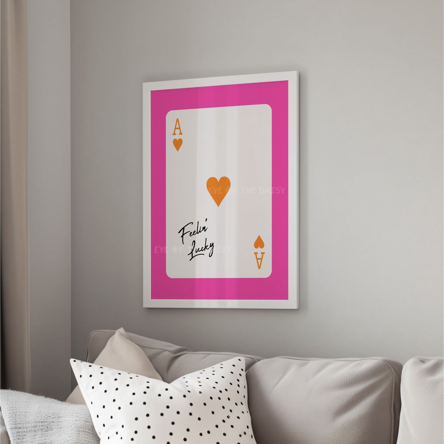 Quirky eclectic ace of hearts poster in bright pink and orange, in a trendy living room