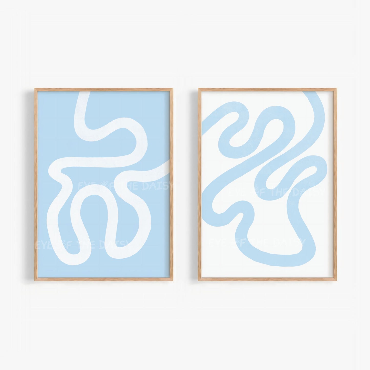 Set of two abstract wall art prints with white and sky blue wavy scribble lines on light blue and white backgrounds