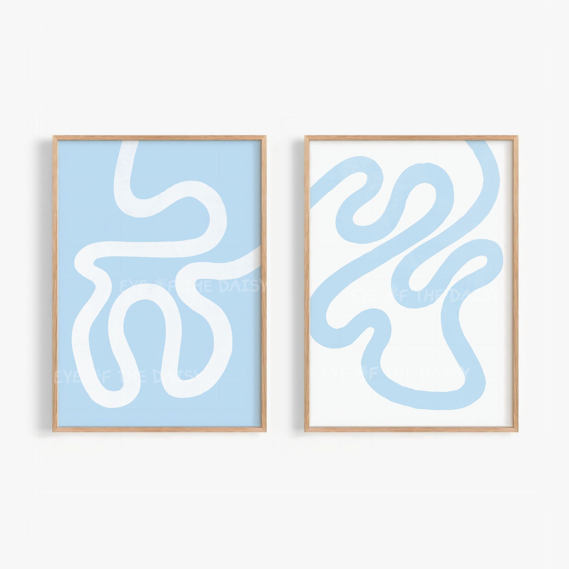 Set of two abstract wall art prints with white and sky blue wavy scribble lines on light blue and white backgrounds