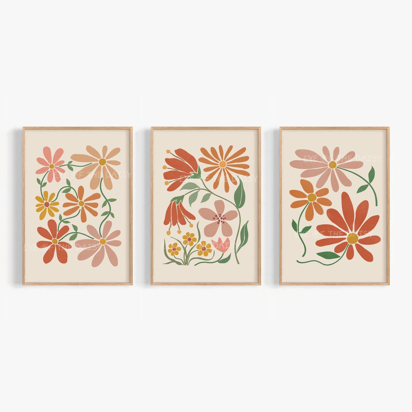 Set of three trendy boho floral wall art prints in terracotta, burnt orange and warm earthy tones on beige