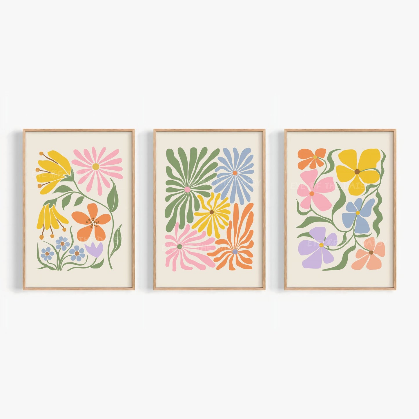 A set of three vibrant botanical abstract digital prints with colorful retro abstract flower cut-outs in pink, mustard yellow, green, lilac, peach, blue and orange on a light beige background
