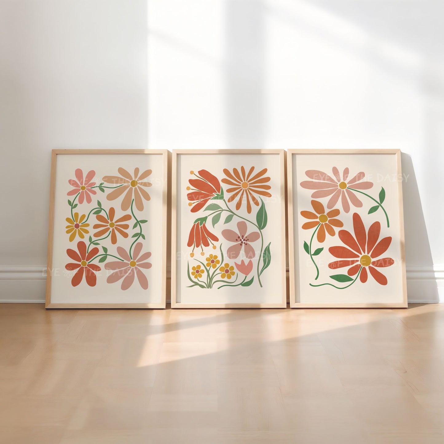 Triptych set of three boho flower wall art prints in earth terracotta rust tones on beige, great for a gender neutral nursery room