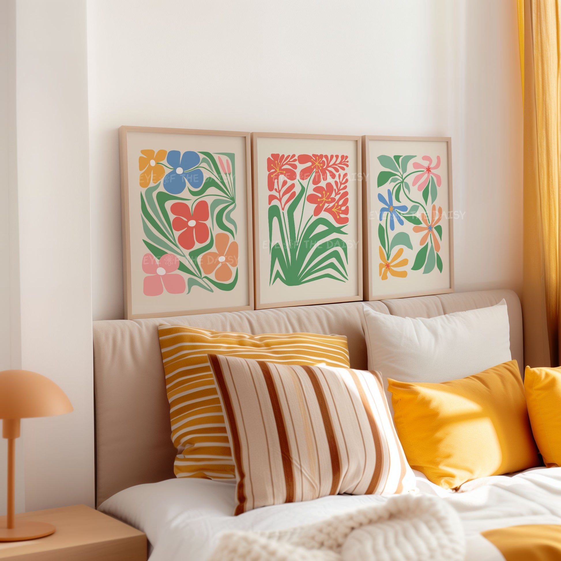 Three piece boho abstract botanical poster set in vibrant red, blue, orange, yellow, pink and green colours for above bed decor