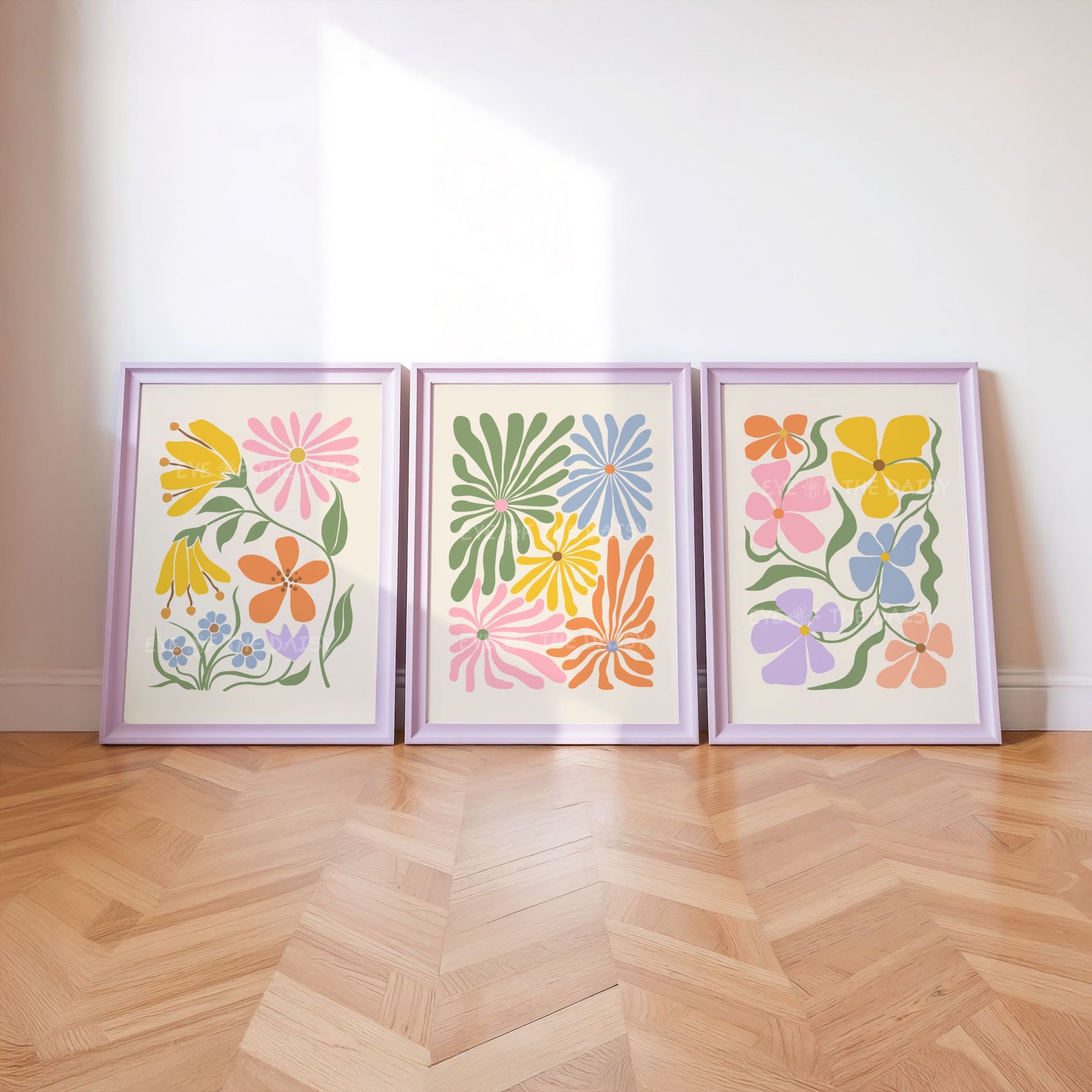 A set of three vibrant botanical abstract digital prints with colorful retro abstract flower cut-outs in pastel pink, mustard yellow, green, lilac, peach