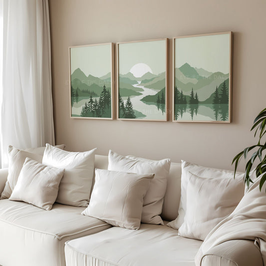 Set of 3 digital art prints of a sage green minimal mountain landscape scene with trees and a river, displayed in a beige living room