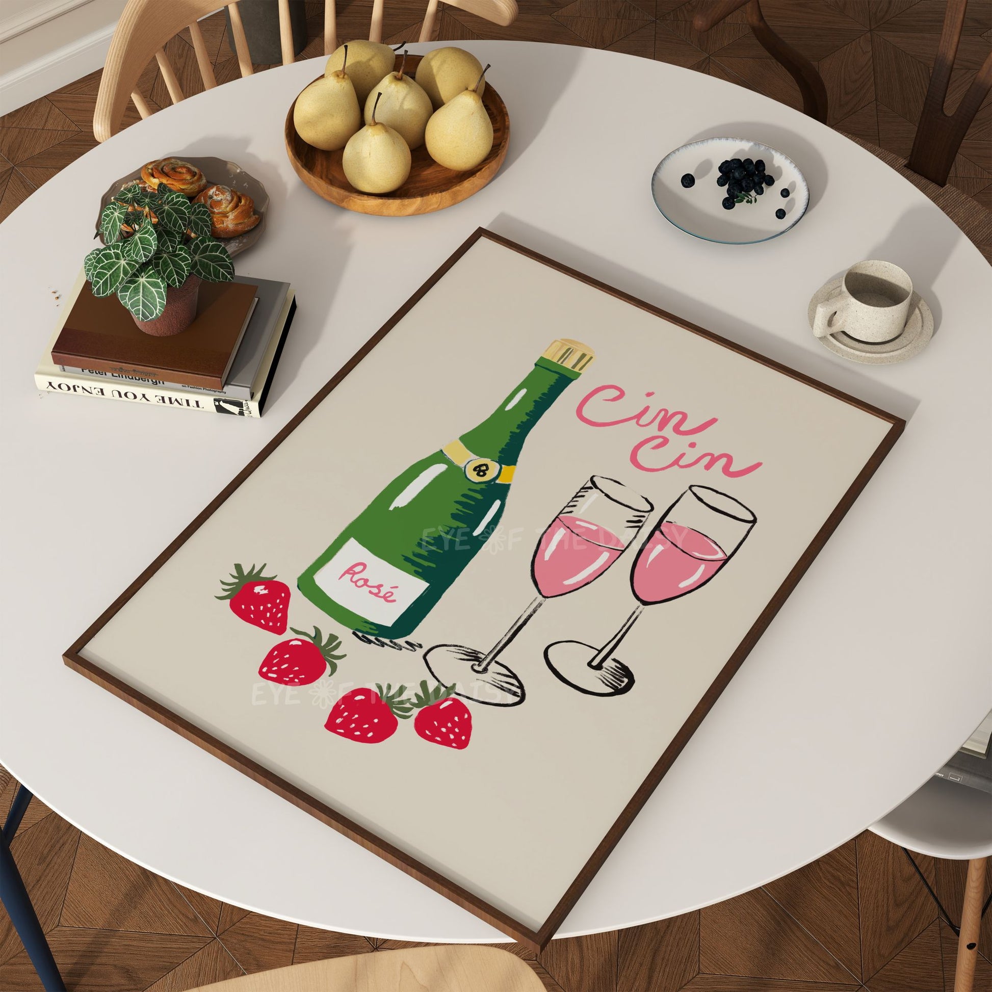 Modern art print showing a hand drawn wine bottle and glasses with the Italian quote "Cin Cin" laying on a kitchen table