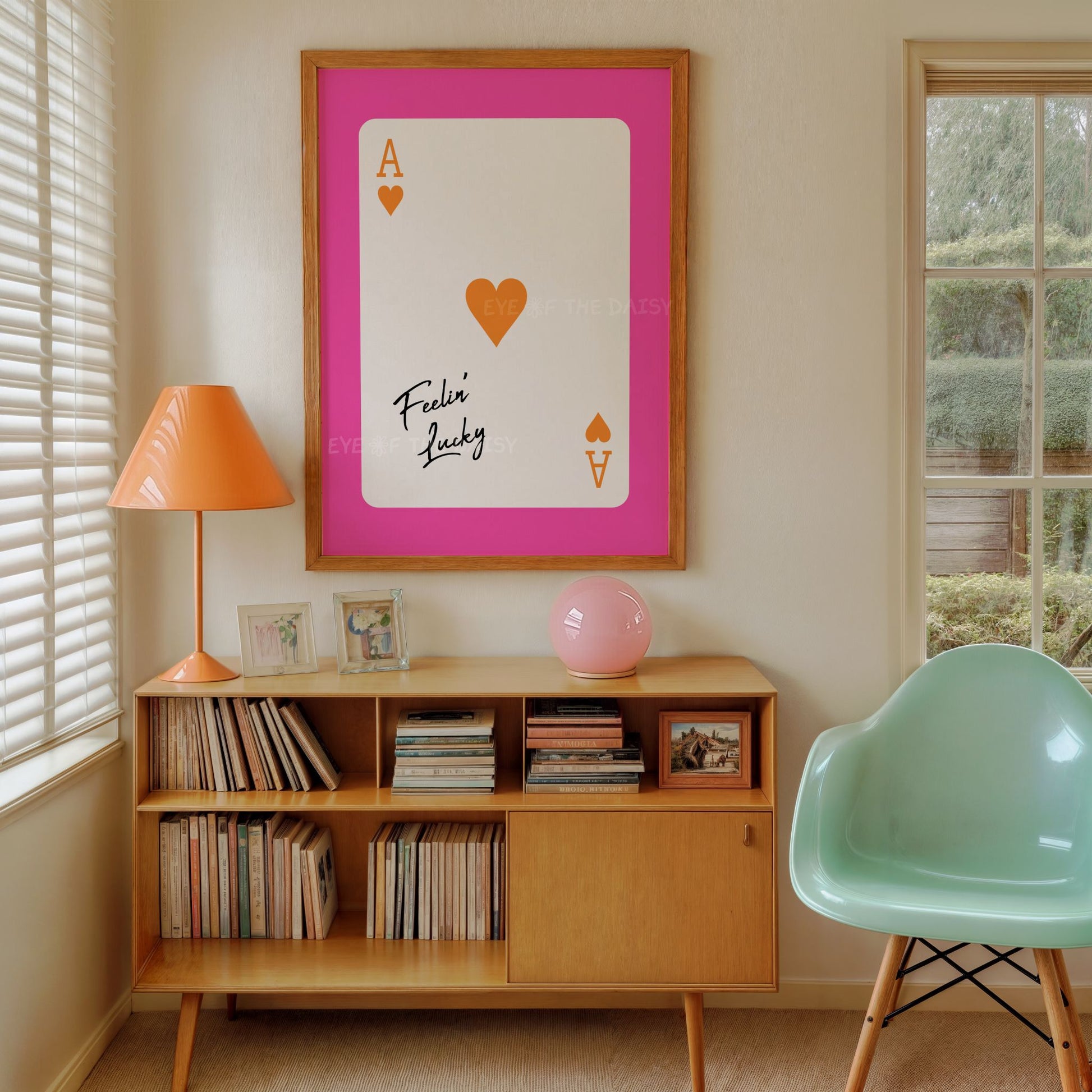 Trendy girl's bedroom wall art print of a pink and orange ace of hearts playing card with "Feeling Lucky" quote