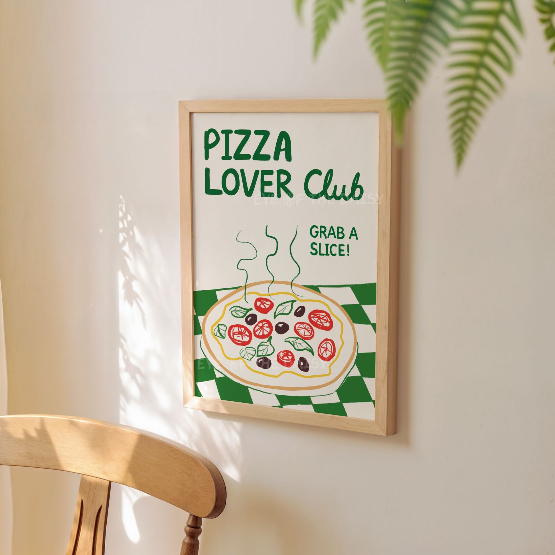 'Pizza Lover Club' printable wall art with a hand drawn pizza illustration, displayed on a kitchen wall