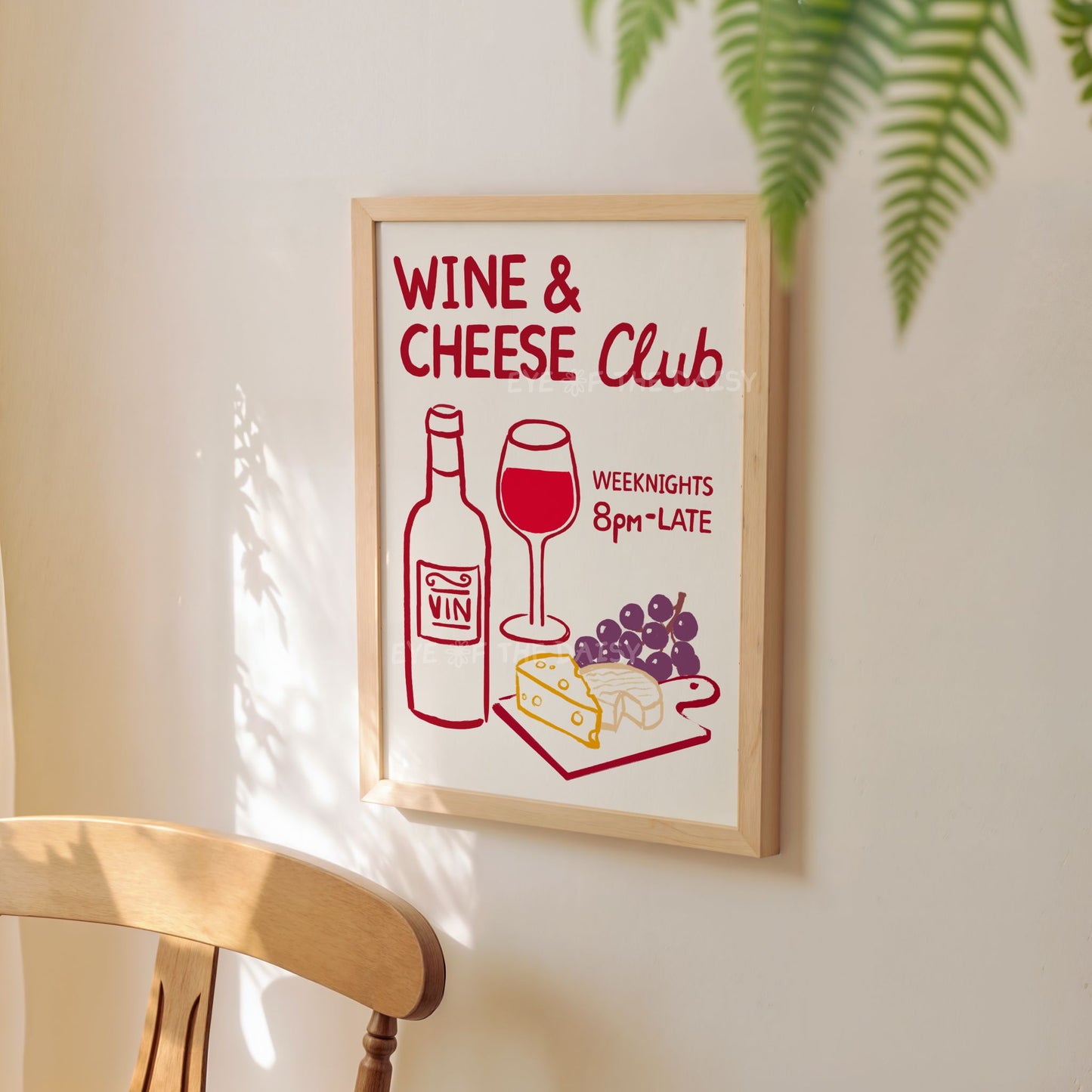 A hand drawn trendy "Wine & Cheese Club" art print of wine and cheese displayed on a kitchen wall