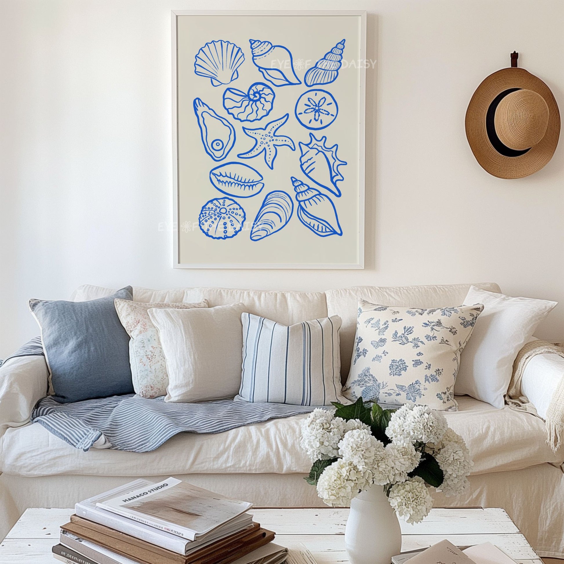 Modern sea shells poster in blue and beige in a Hamptons style living room - makes great coastal decor