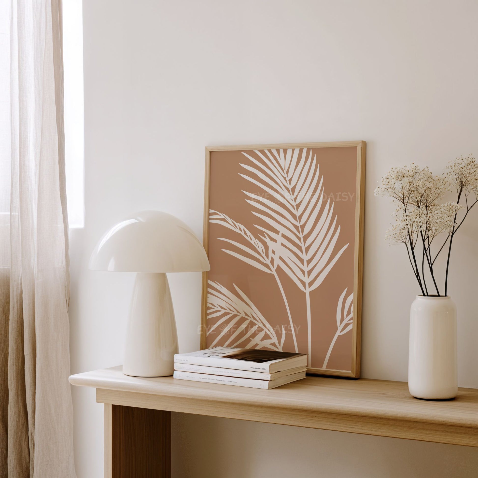 Modern beige and white neutral palm leaf artwork in a boho contemporary minimal style living room