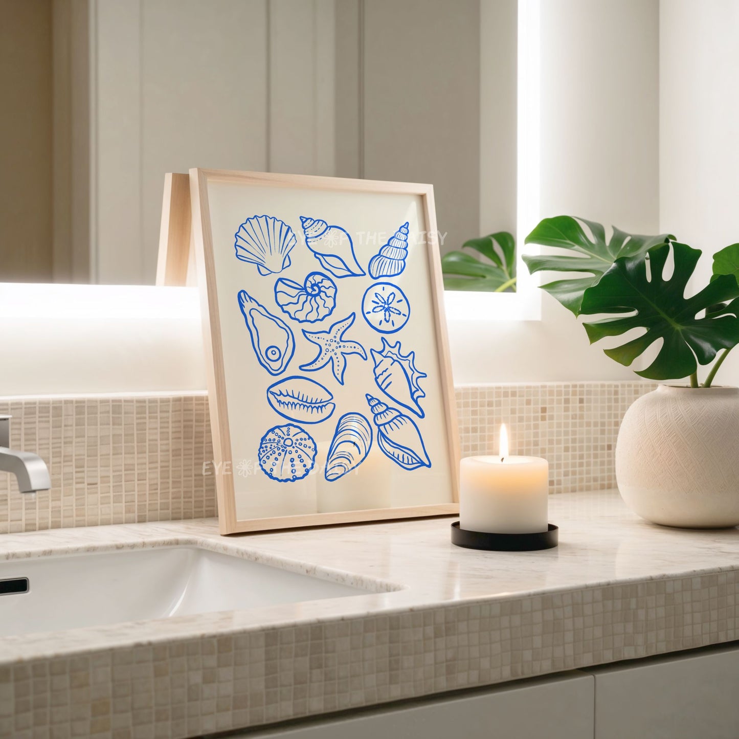 Sea shells printable wall art in blue line drawing on beige, displayed in a modern trendy bathroom