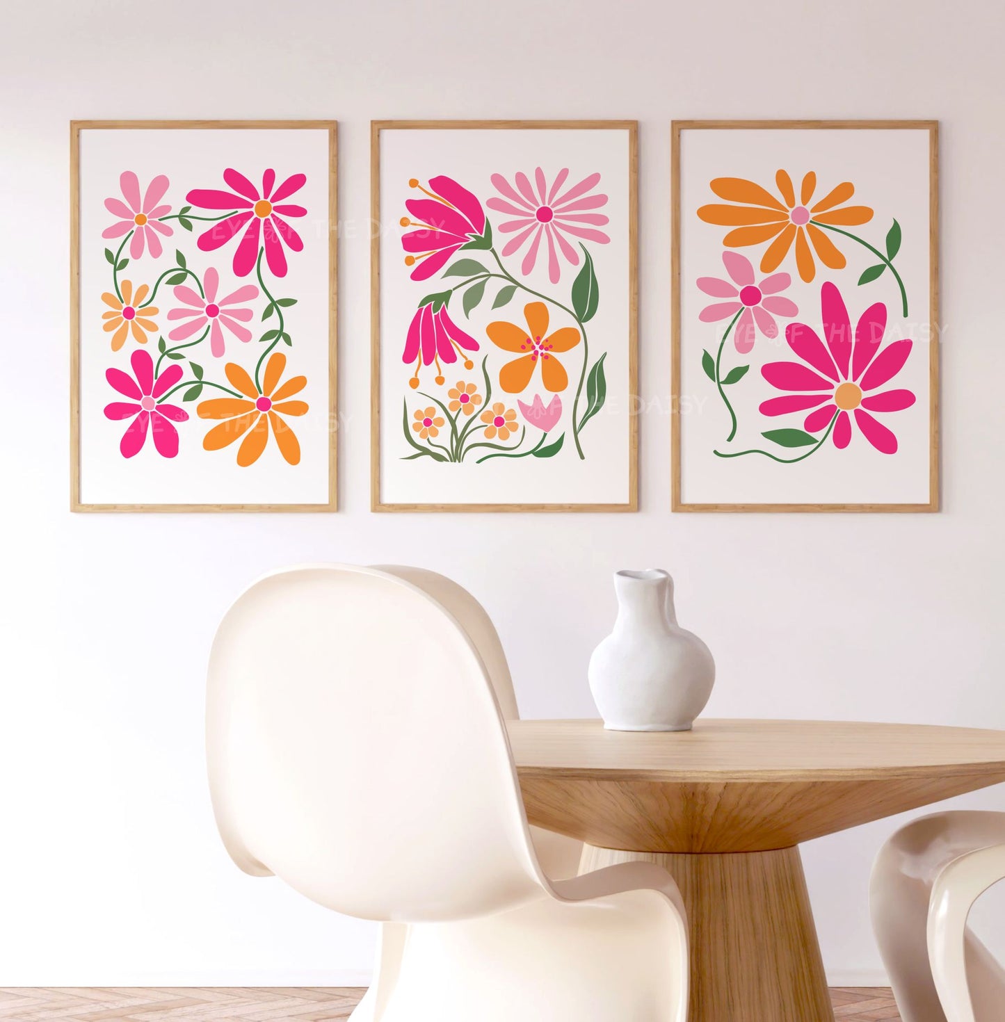 Three piece vibrant pink and orange abstract botanical wall art prints, with stylized flower designs in modern boho style