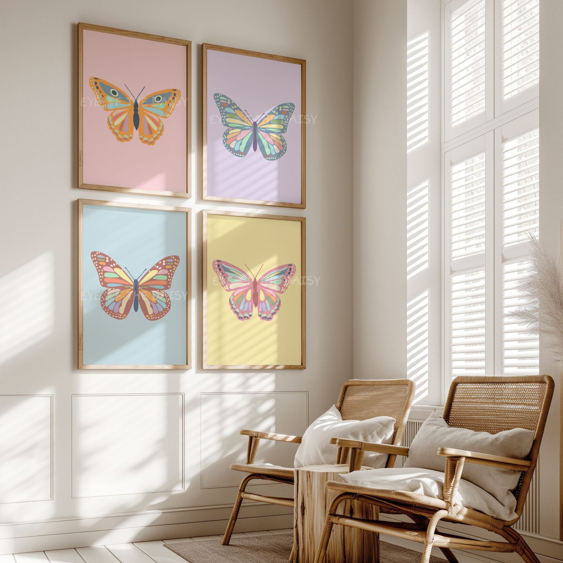 Eclectic vintage butterfly art prints set of 4 in pastel pink, yellow, orange, sky blue and lilac colours, on the wall of a boho nursery room