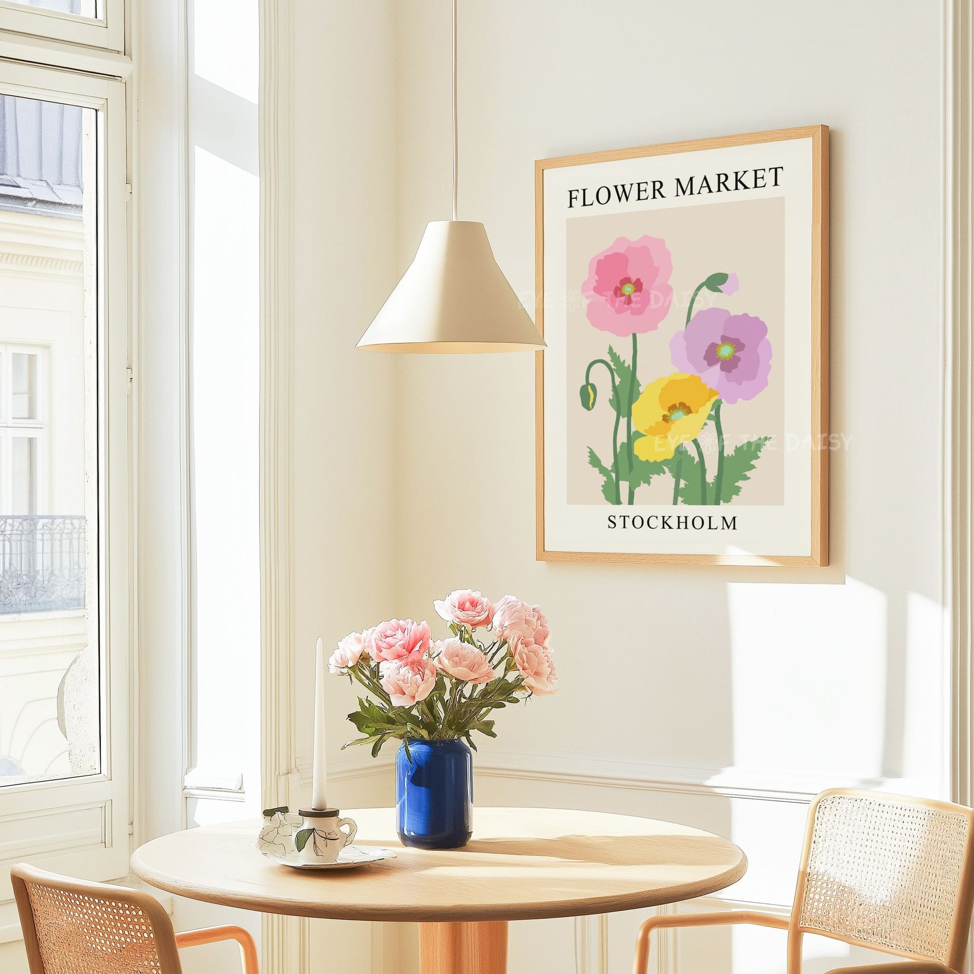 "Flower Market Stockholm" exhibition poster with pastel pink, yellow and lilac poppy design in a modern Scandi apartment