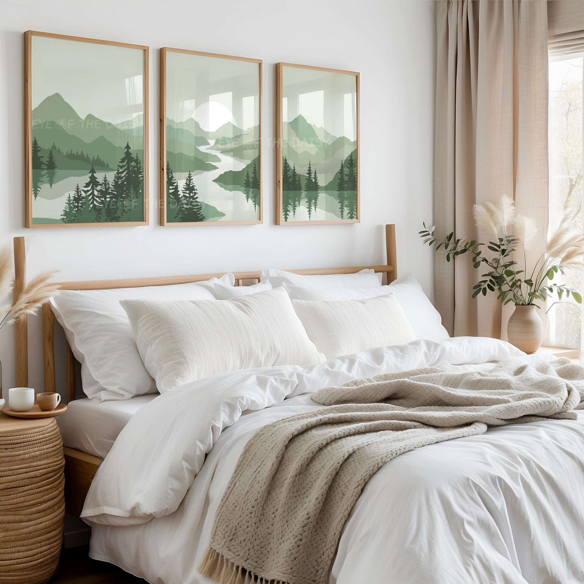 Set of 3 sage green minimal landscape prints on the wall above a bed in a neutral tone white and beige bedroom 