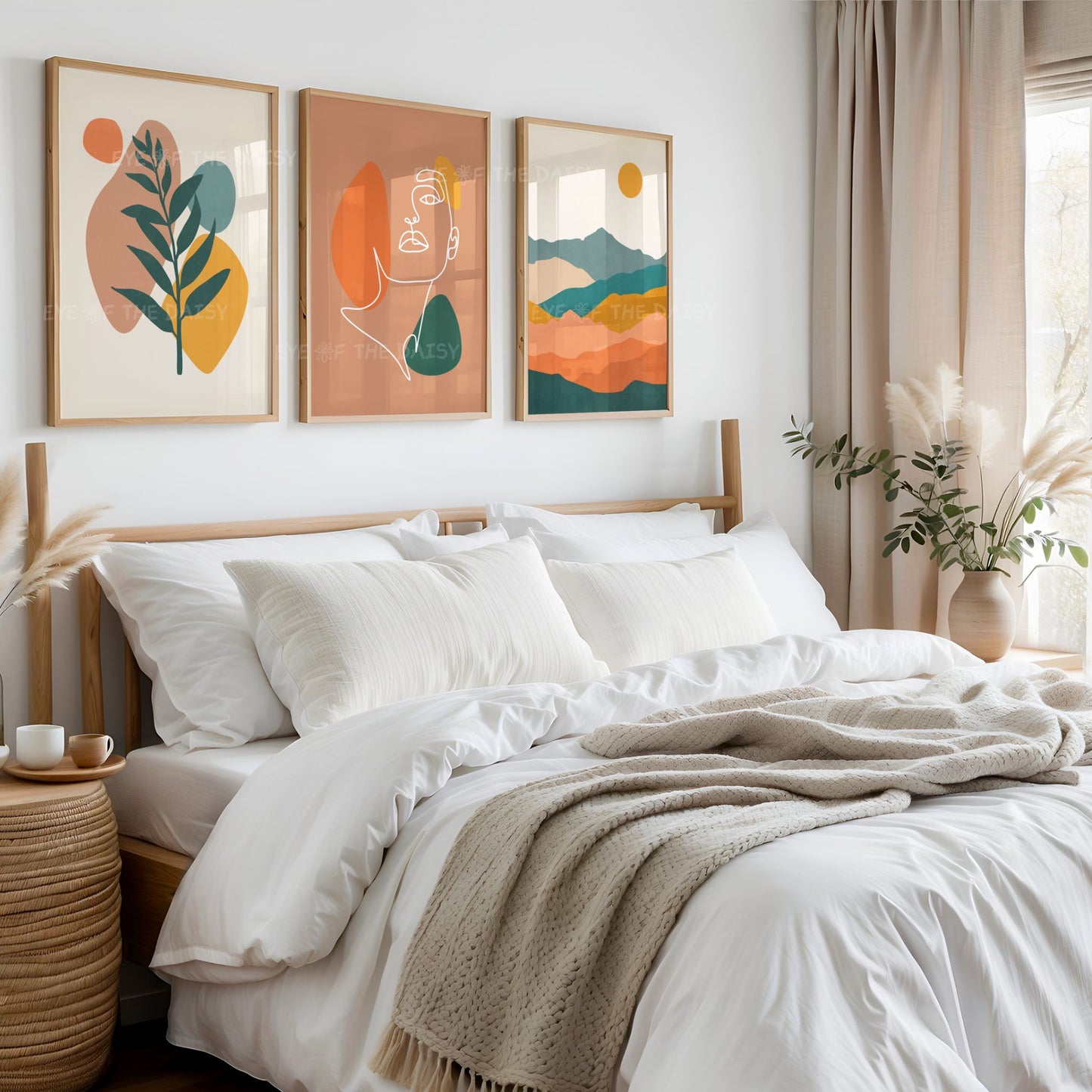 Triptych set of boho downloadable prints in warm earth tones, above a bed in a neutral bohemian bedroom