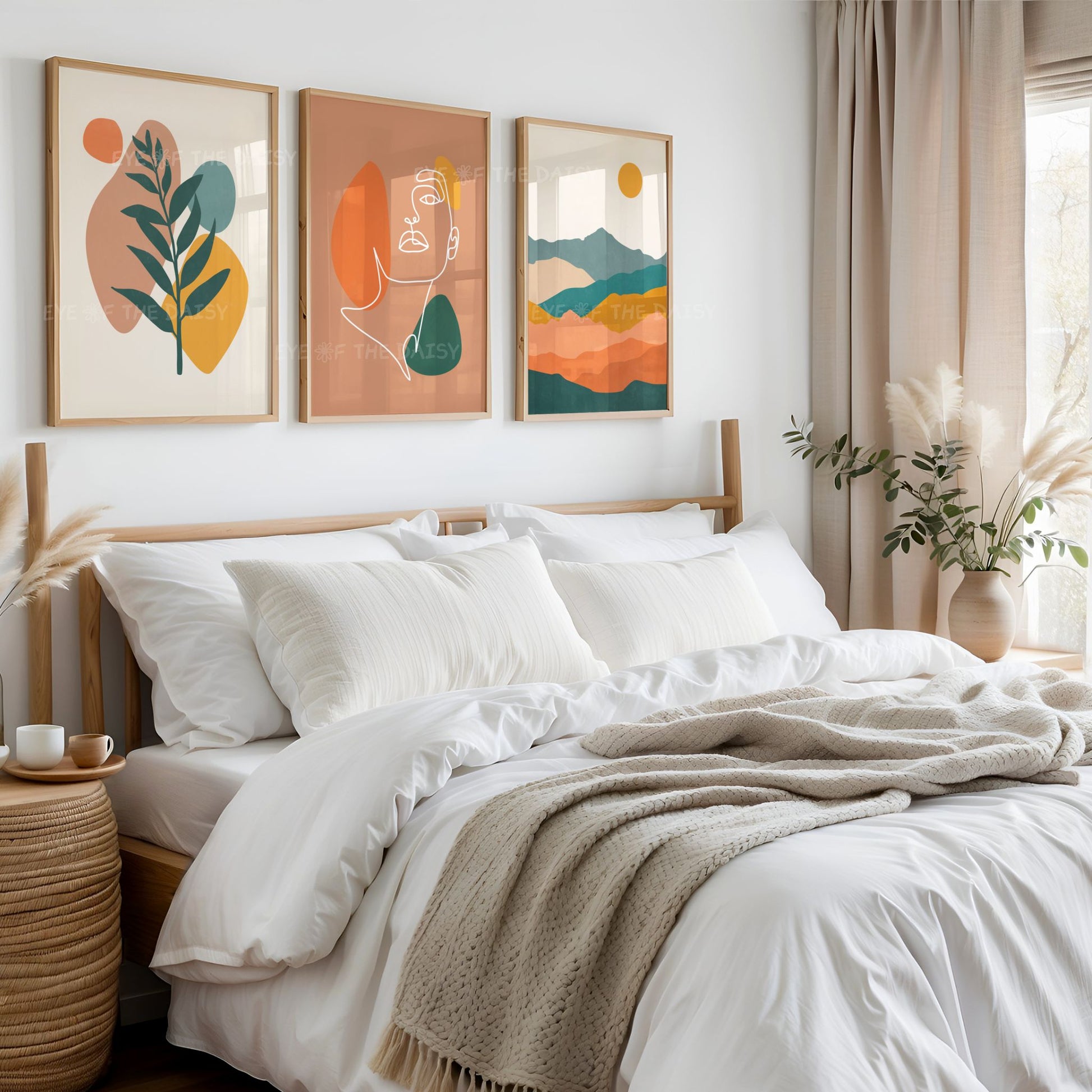 Triptych set of boho downloadable prints in warm earth tones, above a bed in a neutral bohemian bedroom