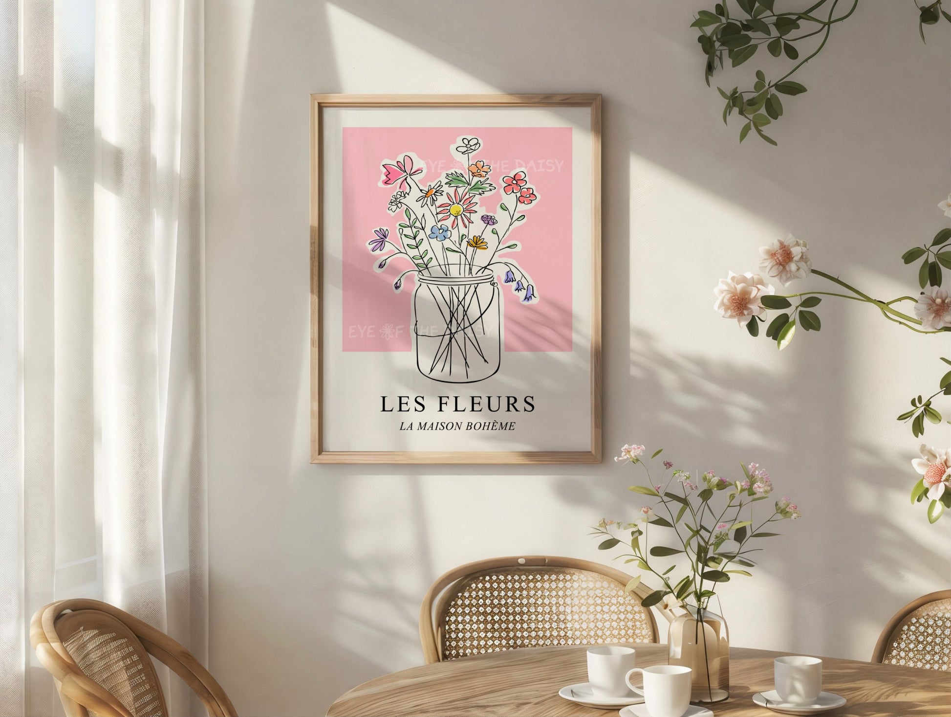 Pretty framed artwork titled 'LES FLEURS' with a hand drawn sketch of a vase of pastel coloured flowers, on the wall in a cozy corner
